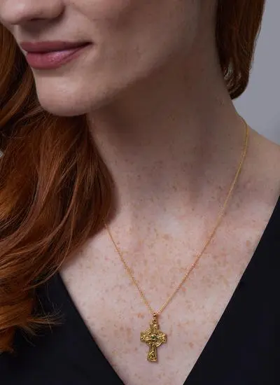 Close up shot of red haired model wearing Celtic Cross Pendant with Green Cubic Zirconia